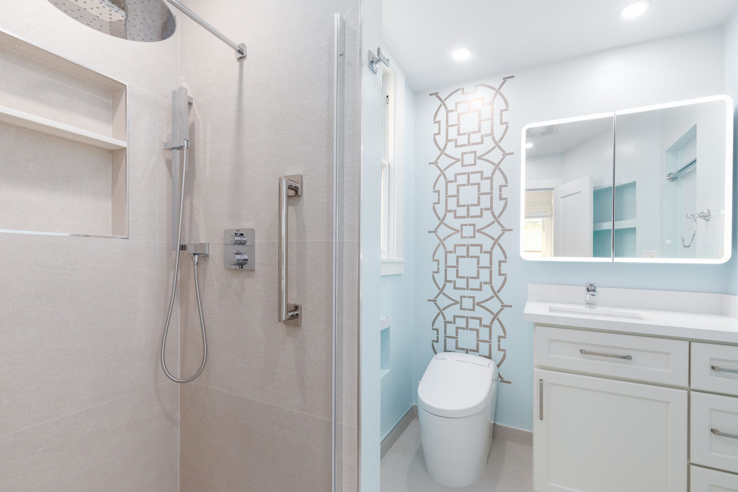 Newly remodeled bathroom in San Ramon with a walk-in shower, modern vanity, and stylish patterned wall.