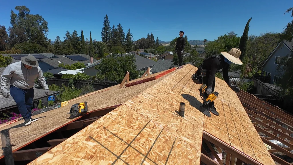 three-roofers-working